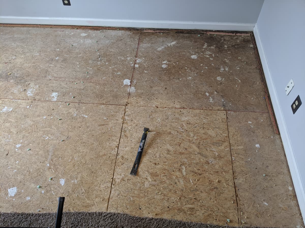 New OSB panels patched into a subfloor